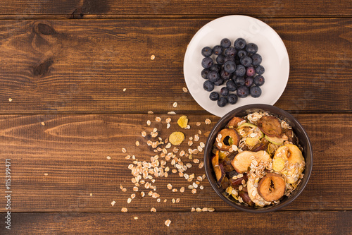 good breakfast, Organic Breakfast Quinoa with Nuts Milk and Berries, Breakfast oatmeal porridge with cinnamon, cranberries and blueberries, , selective focus, close up, front view © Evghenii Blanaru