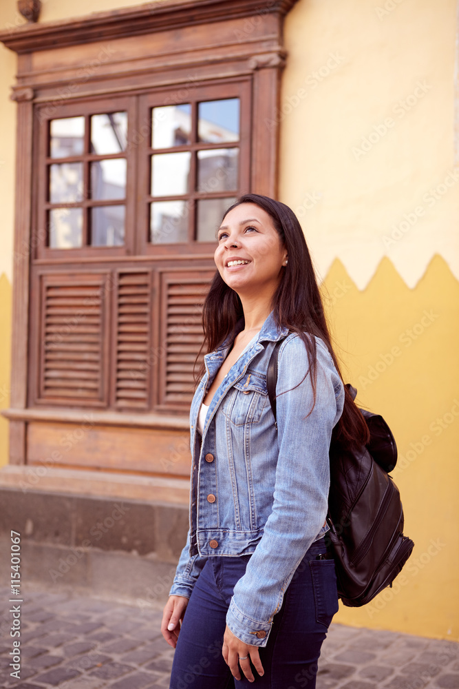 Girl with a back pack looking up Girl with a back pack looking up