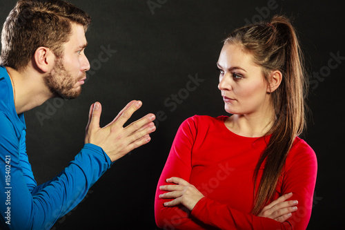 Regretful man husband apologizing upset woman wife