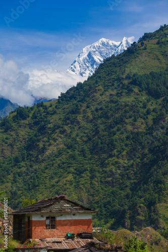 House with mountain landscape in annapurna, Nepal.