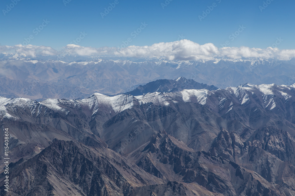 Himalaya mountains under clouds