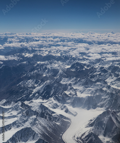 Himalaya mountains under clouds