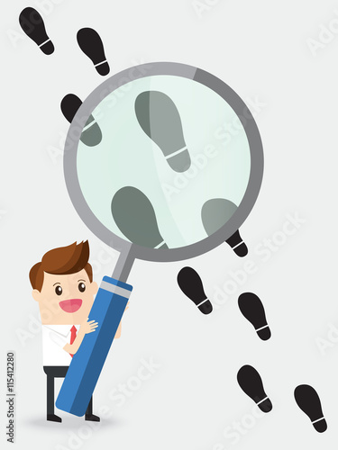 businessman using huge magnifying glass analyze footprints track