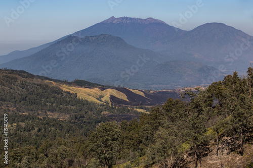 View from the tropical forest with path to the volcano Kawah Ije photo