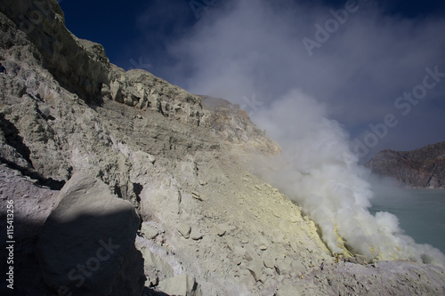 Sulfur mine with workers in Kawah Ijen, Java, Indonesia