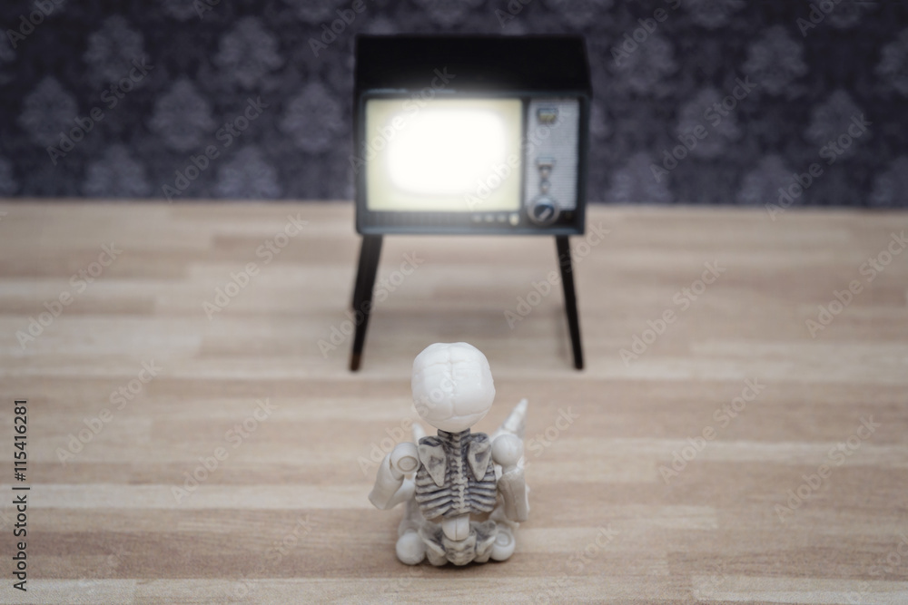 Little skeleton watching TV Stock Photo Adobe Stock