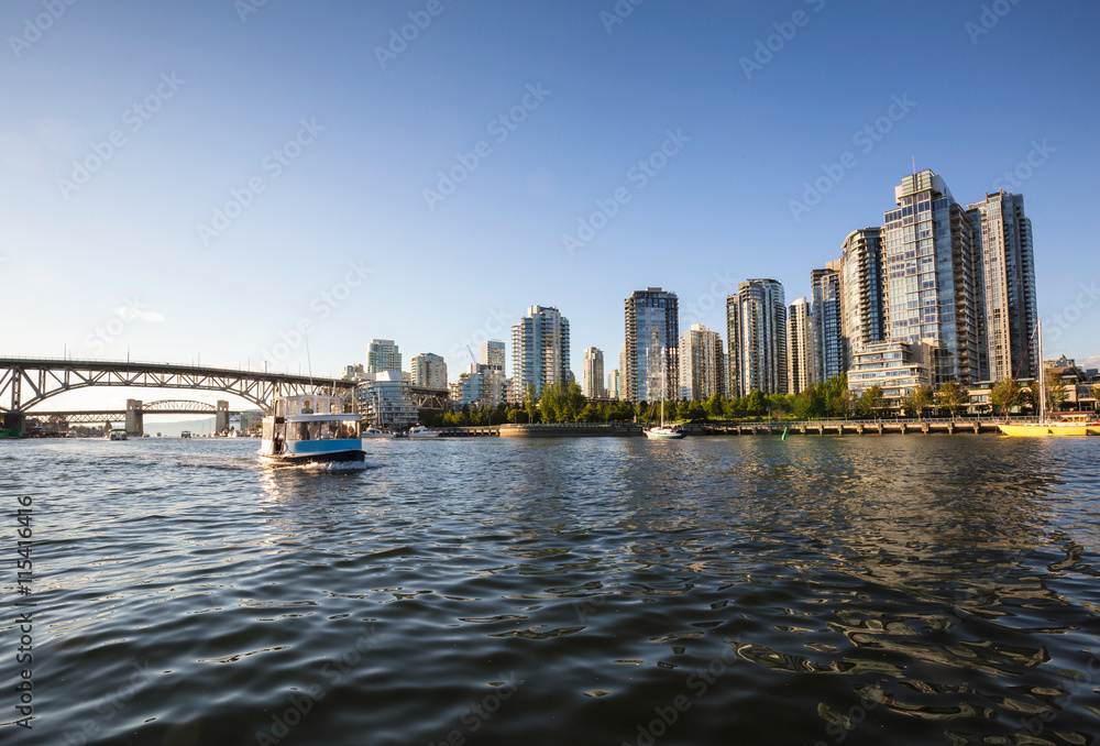 View on Residential buildings and bridges at False Creek in Downtown Vancouver. Taken from the water point of view.