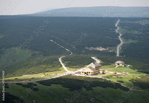 Obri sedlo - saddle - with Slezska bouda from hillside of Snezka in Krkonose in Czech republic photo