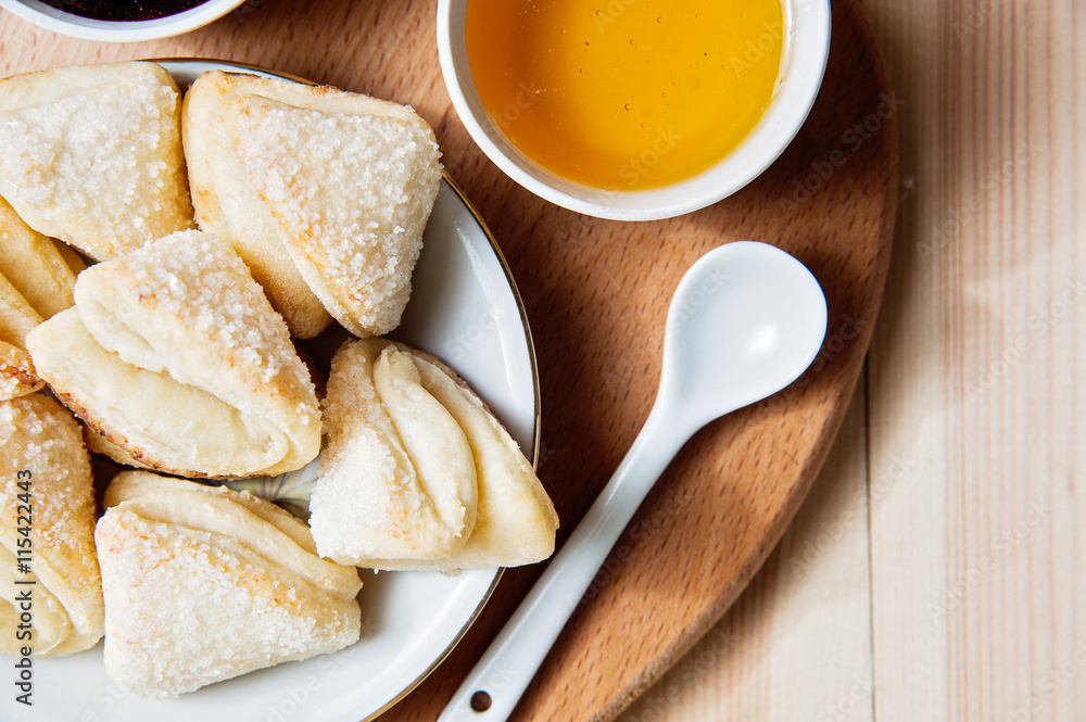 Cheese cookies with honey and jam as a countryside breakfast Cheese cookies with honey and jam as a countryside breakfast