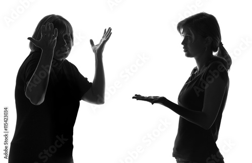 mother and daughter adolescence on isolated background defend their point of view