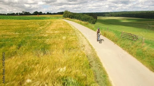 Aerial view of senior man riding his mountain bike