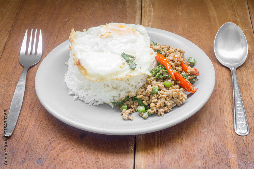 Rice topped with stir fried minced pork and basil. Thai food Rice topped with stir fried minced pork and basil. Thai food