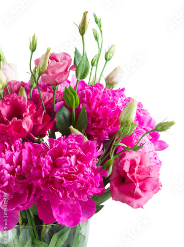 Bright pink peony and eustoma flowers bouquet in blue pot isolated on white background