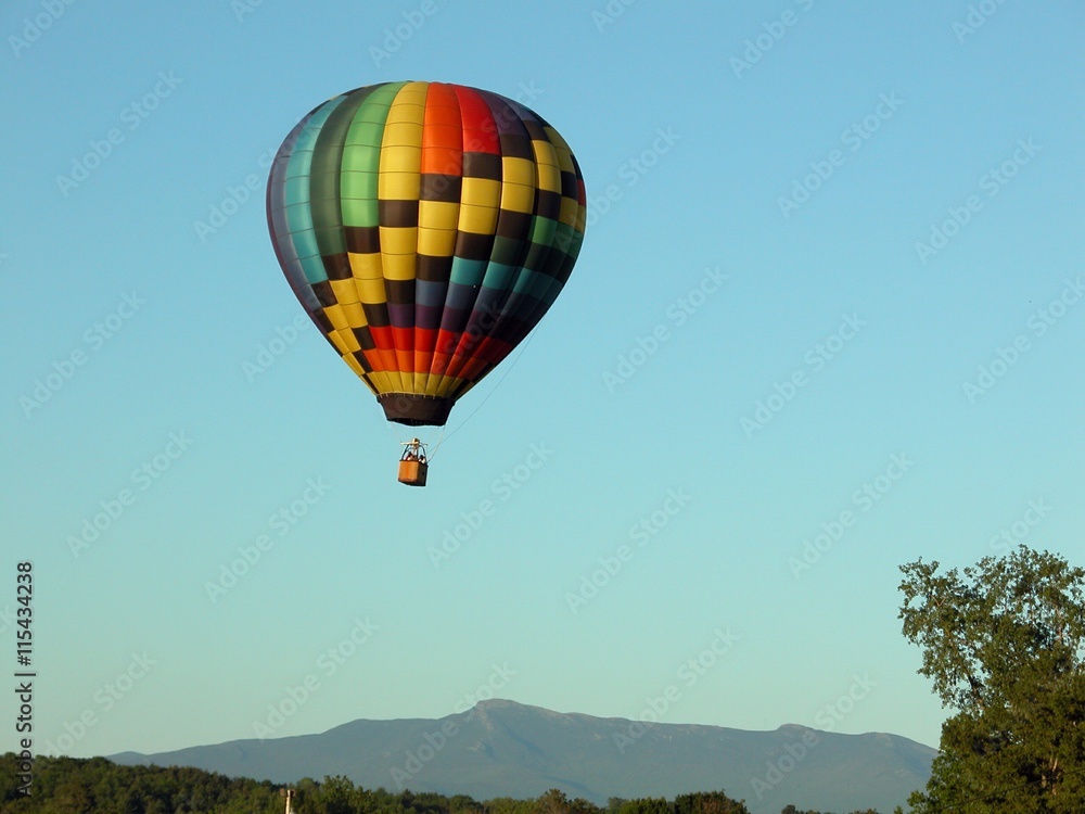 Colorful Hot Air Balloon Over Mountains