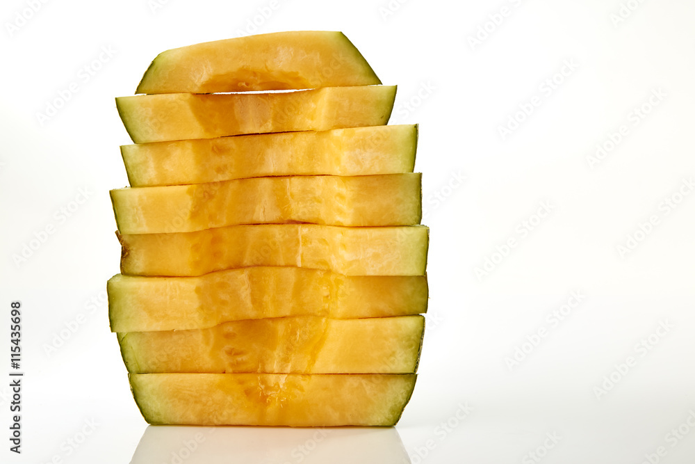Hamigua Melon cut into slices, Hami Melon, Hami Cantaloupe isolated on white background. stack imag Hamigua Melon cut into slices, Hami Melon, Hami Cantaloupe isolated on white background. stack imag