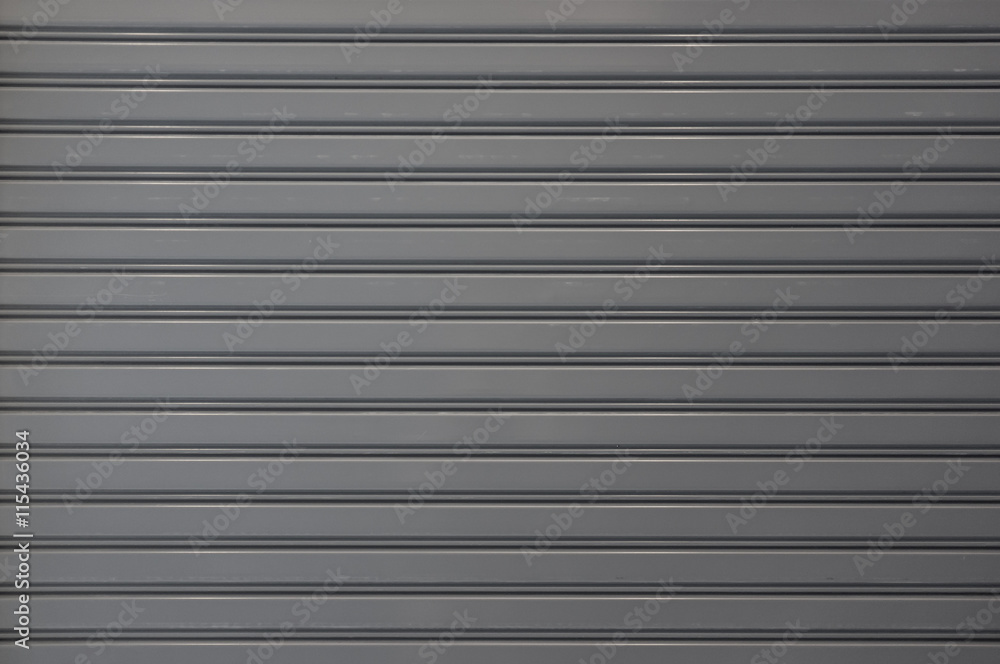 Closeup of steel rolling door of shop or store, front view Closeup of steel rolling door of shop or store, front view