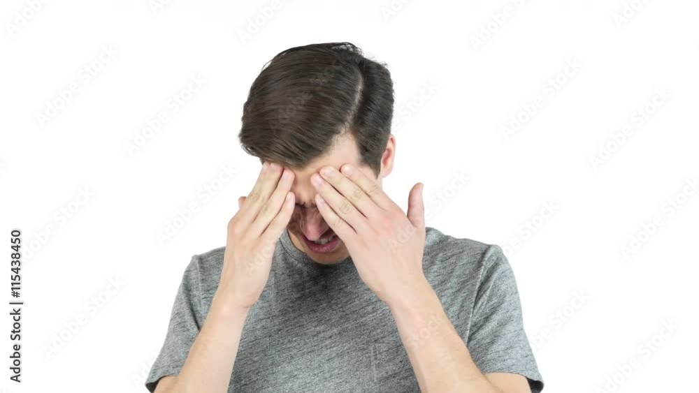 Frustrated adn Tired Young man with a headache - isolated over white Frustrated adn Tired Young man with a headache - isolated over white