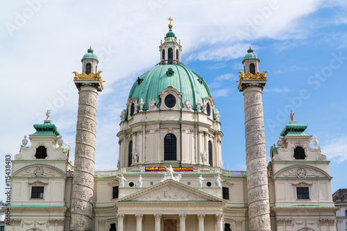 Top of front facade of Karlskirche (Charles Church) with dome and columns on Karlsplatz square in Vienna, Austria