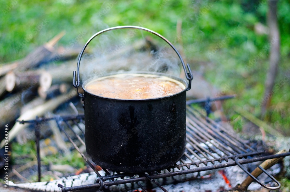 The cooking of soup on the fire The cooking of soup on the fire