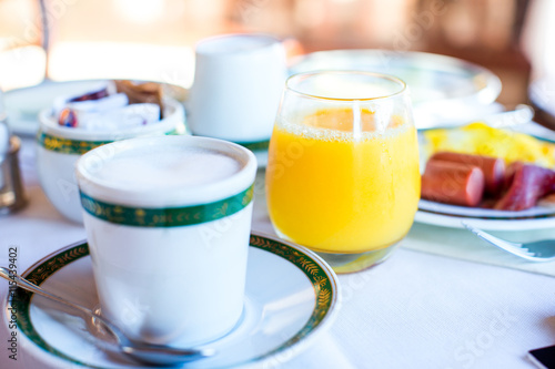 Healthy breakfast, cup of coffee and fresh juice in restaraunt resort outdoor