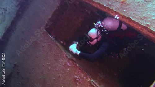 Male scuba diver inside the wreck of the Giannis D, Red Sea, Egypt
 photo