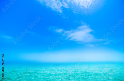 Abstract Blurry Sunny day sea paradise background. Blue sea and