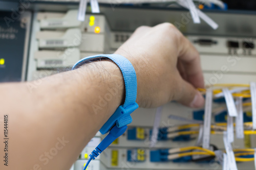 Engineers are checking the electronic board by wearing an antist