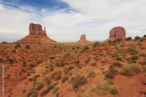 Walking in the Monument Valley with the West and East Mitten Buttes and as well as Merrick's Butte 