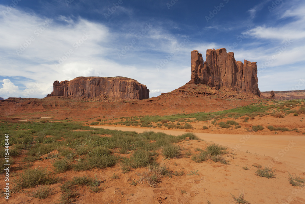 Interesting rock formations on a sunny blue day in Monument Valley, America 
