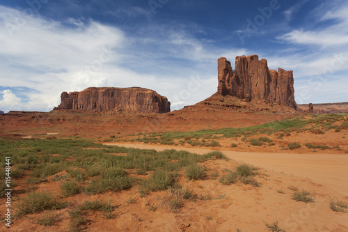 Interesting rock formations on a sunny blue day in Monument Valley, America 
