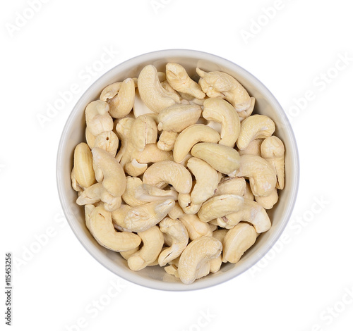 Top view cashew nuts heap in white bowl isolate on white backgro