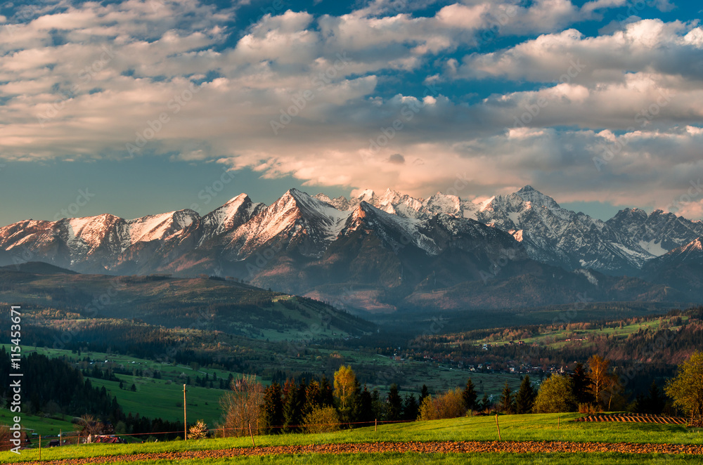 Beautiful spring panorama over Spisz highland to snowy Tatra mountains in the colorful morning, Poland