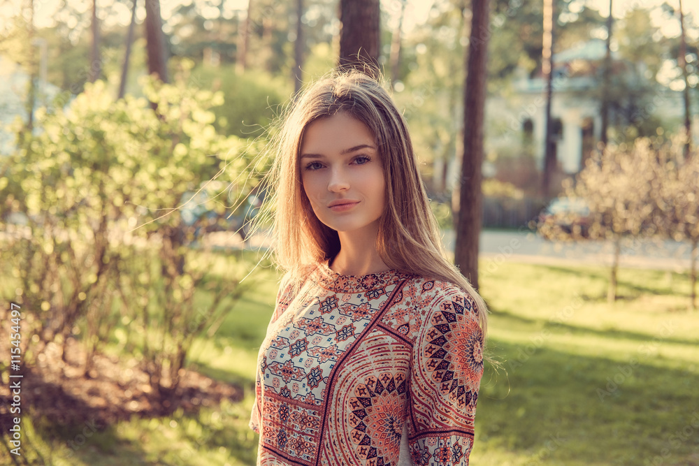 Female posing in a summer park. Female posing in a summer park.