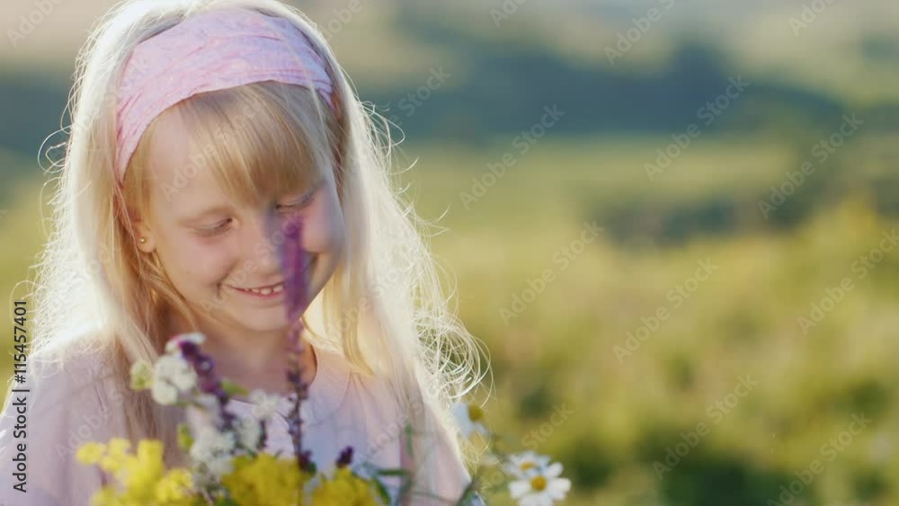 Funny girl 5 years old with a bouquet of flowers. She smiles looking at the camera Funny girl 5 years old with a bouquet of flowers. She smiles looking at the camera