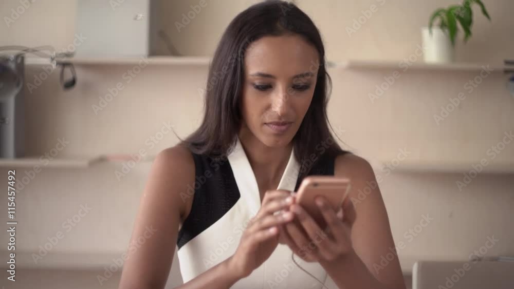 Indian mixed race female send sms use application voice control. Attractive female texting message on mobile phone. Professional employee write mail on the cell. Friendly girl with smile chatting in