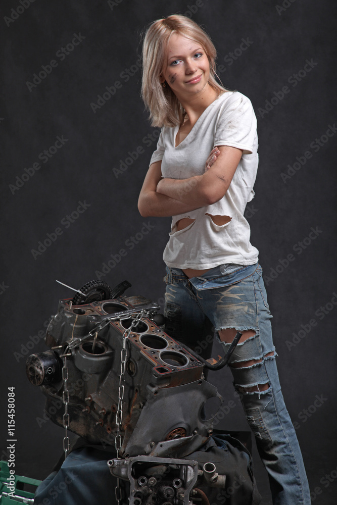 girl in engine oil with wrench key girl in engine oil with wrench key