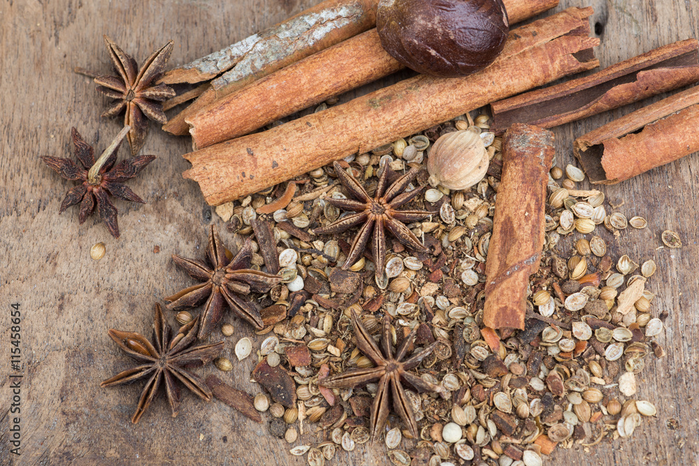 Spices lying on a wooden surface closeup Spices lying on a wooden surface closeup