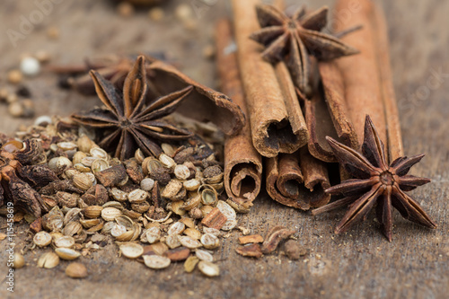 Spices lying on a wooden surface closeup