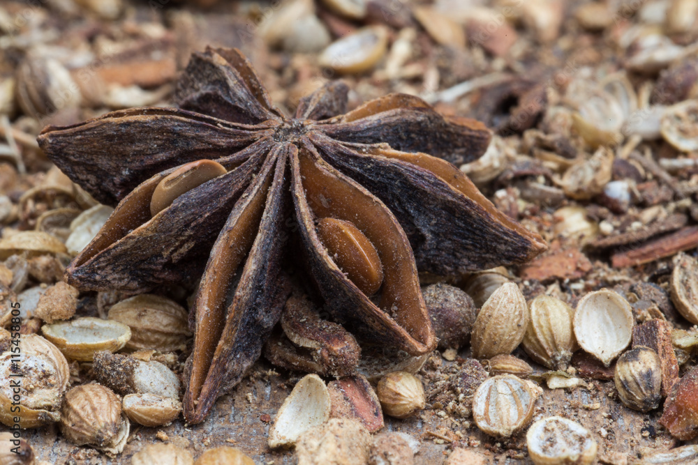 Spices lying on a wooden surface closeup Spices lying on a wooden surface closeup