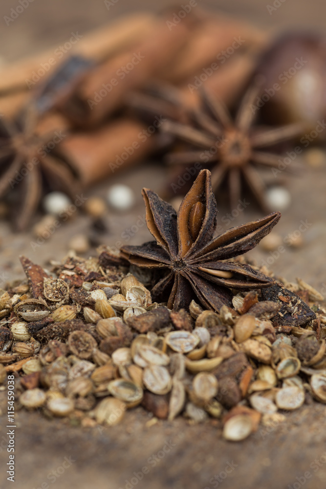 Spices lying on a wooden surface closeup Spices lying on a wooden surface closeup