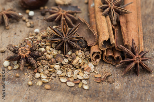 Spices lying on a wooden surface closeup