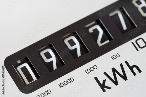 Close-up of electricity meter and showing kilowatt  hour symbol. Cost of living.