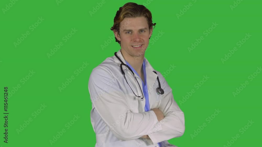 Friendly male doctor turns to camera (Green Key) Friendly male doctor turns to camera (Green Key)