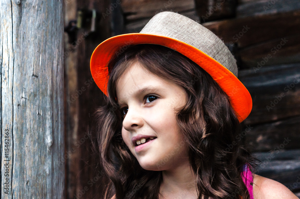 little girl sitting on the porch of the house Stock-Foto | Adobe Stock