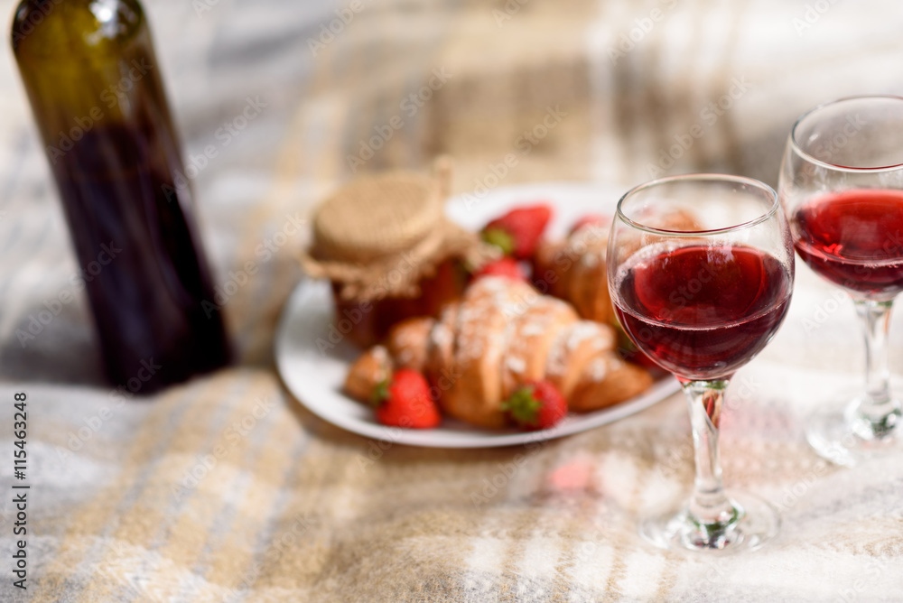 Wineglasses with pasty and strawberry for romance
