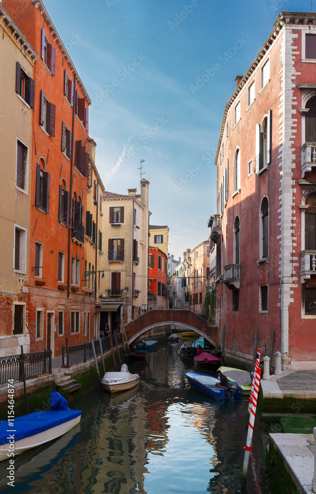 traitional Venice houses and bridge over water of small cosy canal in old town, Italy