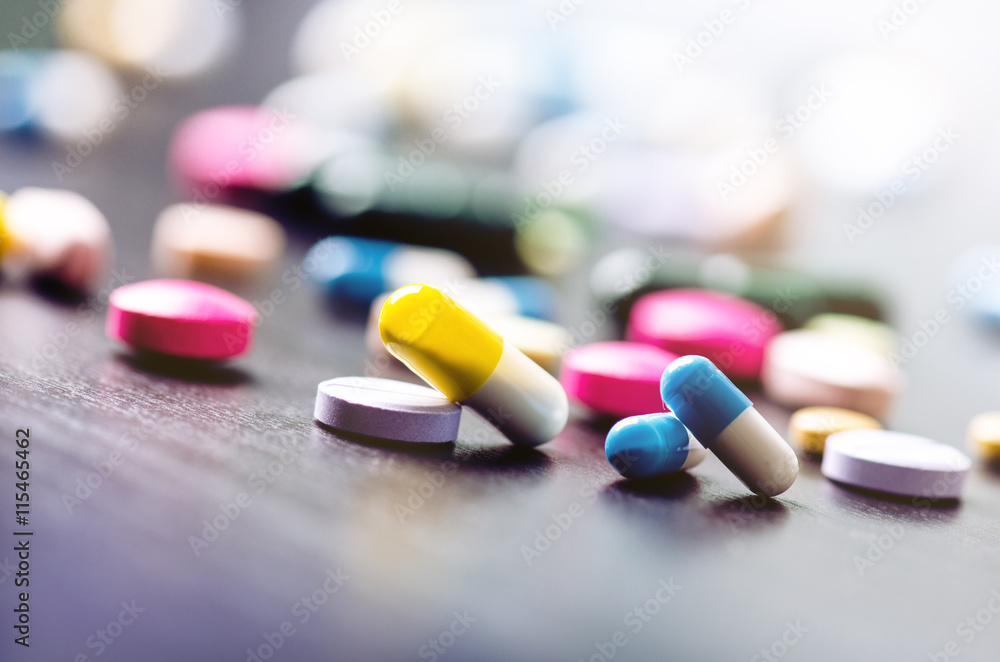 Pharmacy background on a black table. Tablets on a black background. Pills. Medicine and healthy. Close up of capsules. Differend kind of pills Pharmacy background on a black table. Tablets on a black background. Pills. Medicine and healthy. Close up of capsules. Differend kind of pills
