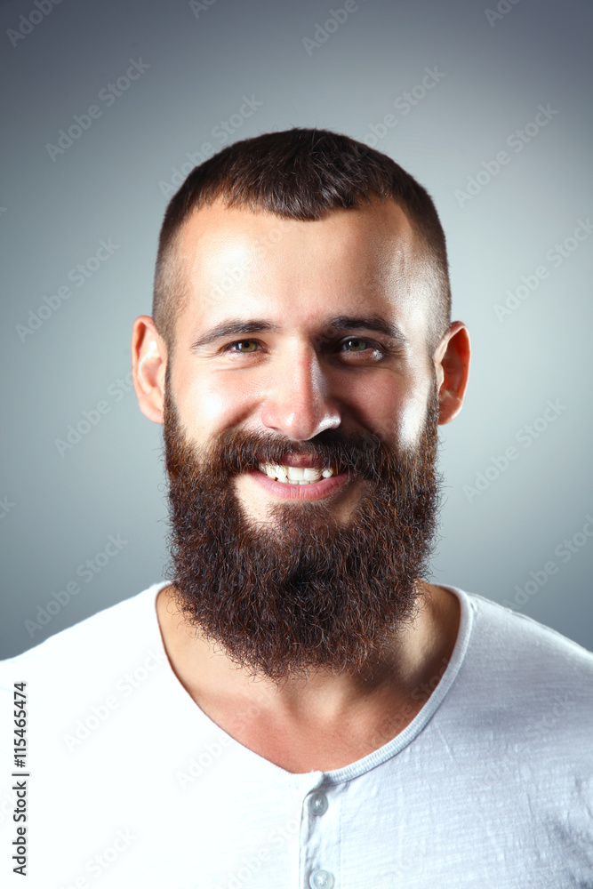 Obraz premium Portrait of handsome man standing, isolated on grey background