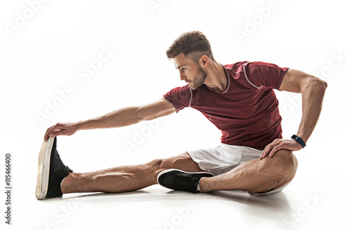 Strong male athlete training his body photo