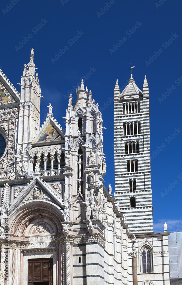 fragment of Siena cathedral in a sunny day, Tuscany, Italy..